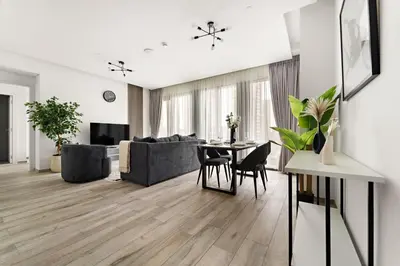 a living room with a table and a couch at StoneTree - Newly Furnished - Stylish in Dubai