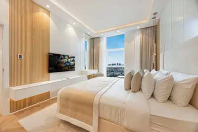a bedroom with a large bed with a large window at Daniels Full Sea View 3BR in Oceana Atlantic in Dubai