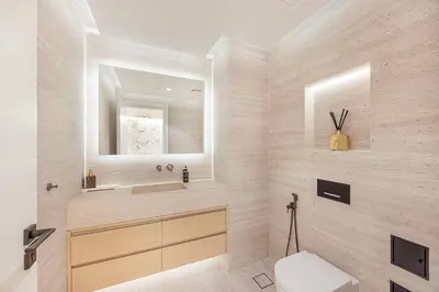 a bathroom with a sink and a toilet and a mirror at Daniels Full Sea View 3BR in Oceana Atlantic in Dubai