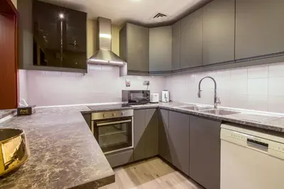 a kitchen with a sink and a microwave at Two-Bedroom Apartment with Balcony in Shams 4, JBR in Dubai