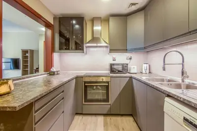 a kitchen with a sink and a counter top at Two-Bedroom Apartment with Balcony in Shams 4, JBR in Dubai