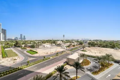 an aerial view of a city with a highway at Chic 1BR Retreat - Near Burj Khalifa & Dubai Mall in Dubai