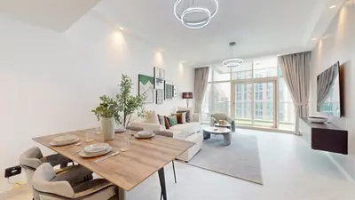 a living room with a table and a couch at Marinascape Oceanic - Luxurious Two Bedroom in Dubai