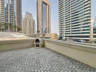a balcony with a view of a city with tall buildings at Marinascape Oceanic - Luxurious Two Bedroom in Dubai