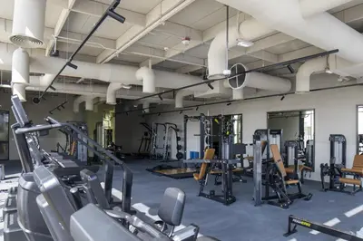 a gym with cardio equipment and treadmills at Modern Studio at Upside Living, Business Bay with Burj Khalifa View in Dubai
