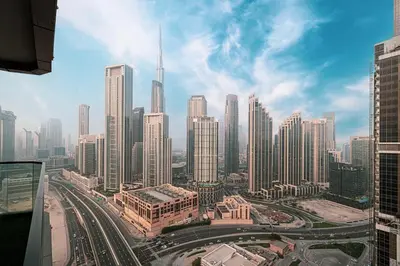 a view of a large city with tall buildings at Panoramic Burj Khalifa views-64th floor infinity pool in Dubai