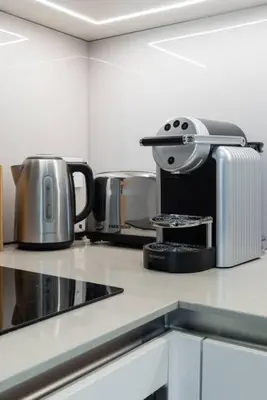 a kitchen counter with a toaster and appliances on it at Address JBR l Beachfront l Mid floor & opened view in Dubai