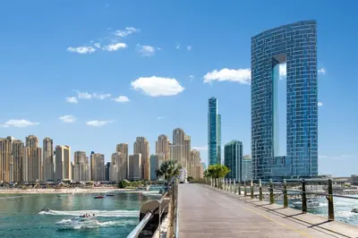 a boardwalk in a city with tall buildings at Address JBR l Beachfront l Mid floor & opened view in Dubai