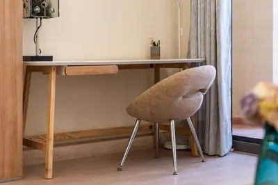 a desk with a chair in front of a table at Luxury 1 bedroom apartment in JBR with Beach access in Dubai