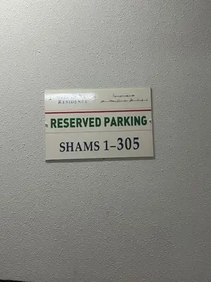 a reserved parking sign on the ceiling of a room at Luxury 1 bedroom apartment in JBR with Beach access in Dubai