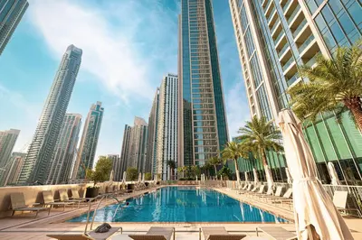 a swimming pool in a city with tall buildings at Kabene Exotic, Burj Khalifa & Fountain View, 5 Starts, 4 Bedroom, Best In Dubai in Dubai