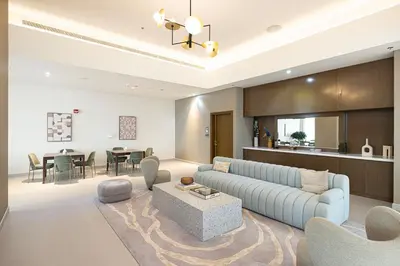a living room with a couch and a table at Kabene Exotic, Burj Khalifa & Fountain View, 5 Starts, 4 Bedroom, Best In Dubai in Dubai