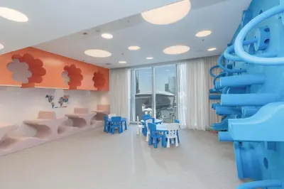 a room with blue chairs and a blue slide at Kabene Exotic, Burj Khalifa & Fountain View, 5 Starts, 4 Bedroom, Best In Dubai in Dubai