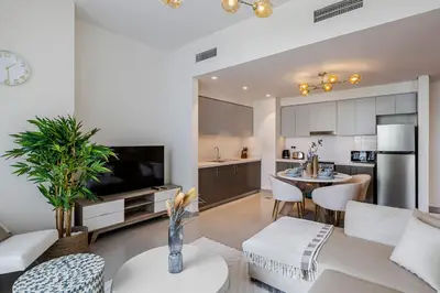 a living room with a kitchen and a dining room at 1BR Forte II Downtown View in Dubai