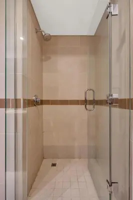 a shower with a glass door in a bathroom at Bellavista - 29 BLVD - 1 Bedroom Burj Khalifa & Fountain View in Dubai