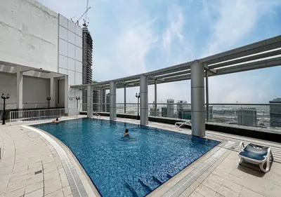a swimming pool on the roof of a building at lux 2BD in heart of Downtown, 2 Mins Walk to Dubai Mall - Burj al Nujoom in Dubai