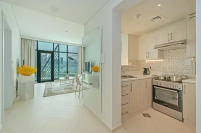a large white kitchen with a stove top oven at Beach access I Sea View I Infinity pool in Dubai