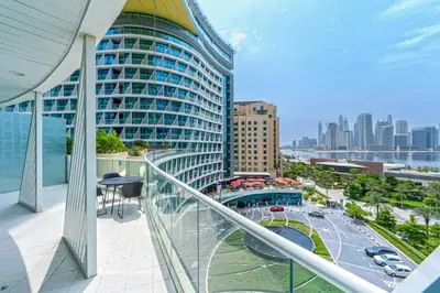 a balcony with a view of a large building at Beach access I Sea View I Infinity pool in Dubai