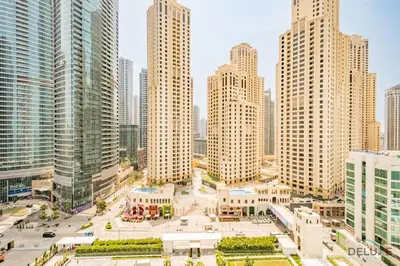 an aerial view of a city with tall buildings at Sophisticated 1BR Apartment in La Vie, Jumeirah Beach Residences by Deluxe Holiday Homes in Dubai