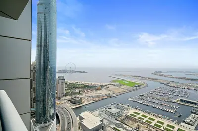 an aerial view of a city with a tall building at Sky Haven in 45th Floor 2BR with Dubai Harbour Views in Dubai