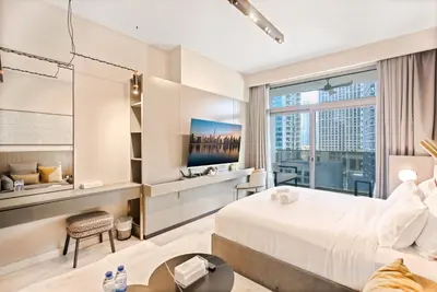 a hotel room with a large bed and a window at MAG318 Downtown Luxury - 5 Min Walk to Burj & Mall in Dubai