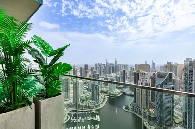 a balcony with a view of a city at Daniels 1BR Marina Horizon Retreat in Dubai