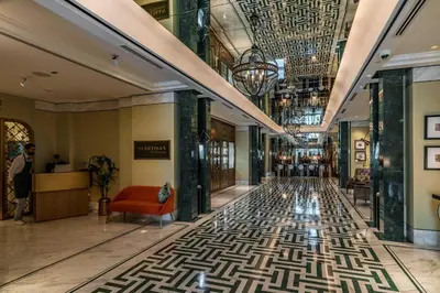 a lobby with a hallway with a floor with a pattern at Silkhaus Spacious Studio in Heart of DIFC in Dubai