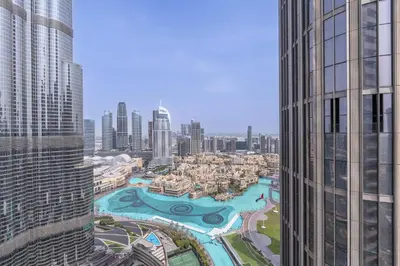 a view of a city from a skyscraper at Address Residences Dubai Opera - Burj Khalifa City Views 1, 2, & 3-Bedroom Apartment 1 minute walk to Burj Khalifa, Dubai Mall, Dubai Fountain by Heaven Crest in Dubai