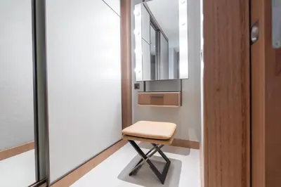 a stool in a room with a mirror at Address Residences Dubai Opera - Burj Khalifa City Views 1, 2, & 3-Bedroom Apartment 1 minute walk to Burj Khalifa, Dubai Mall, Dubai Fountain by Heaven Crest in Dubai