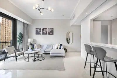 a living room with a couch and a table at Daniels 1BR at Silverene Tower Dubai Marina in Dubai
