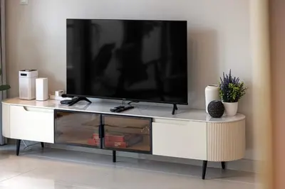 a white entertainment center with a flat screen tv on it at Daniels 1BR at Silverene Tower Dubai Marina in Dubai