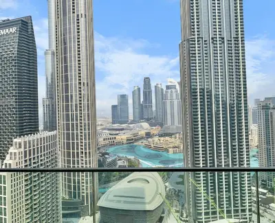 a view of a city with tall buildings at Incredible View - Fountain show - 4BR - PS5 and Games in Dubai