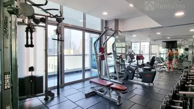 a gym with treadmills and machines in a building at First Line Canal View Studio with Balcony MAX 4 Pax in Dubai