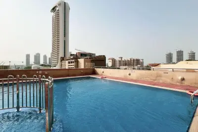 a large swimming pool on the roof of a building at Lux 2BR with Sea Views in Marina in Dubai