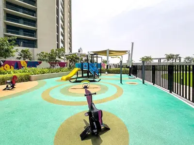 a playground with a slide at Goldbest - Aykon City 2bdr in Dubai