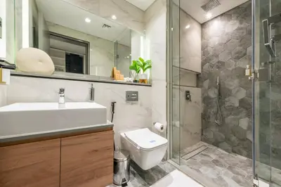 a bathroom with a toilet and a sink and a shower at Canal View Studio Downtown - Near Dubai Mall & Burj Khalifa - MAG 318 in Dubai