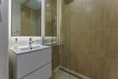 a bathroom with a sink and a mirror at Stylish Studio with Gym & Pool Access in Dubai