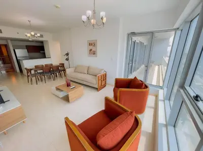 a living room with a couch and a table at Luxury Holiday Home Just Minutes from Dubai's Global Village Your Perfect Getaway!
