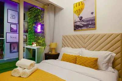 a bedroom with a bed with towels on it at Gorgeous 2BR with full Burj Khalifa view, 5 mins from Dubai Mall in Dubai