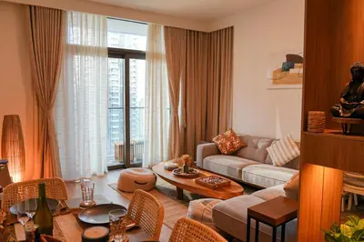 a living room with a couch and a table at Luxury Downtown Dubai Burj Khalifa & Fountain View in Dubai