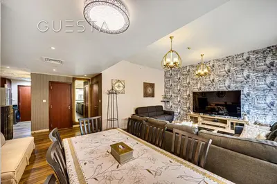 a dining room and living room with a fireplace at Jumeirah Beach Residence - Bahar 1, Dubai Marina in Dubai