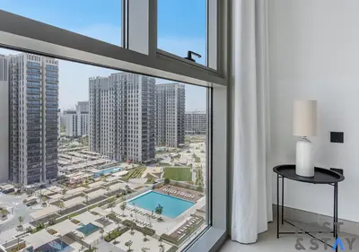 a room with a large window with a view of a city at Minimalist 2BR in Dubai Hills in Dubai