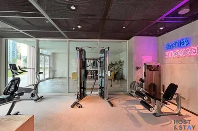 a gym with two treadmills and two tread machines at Stunning 1BR in Dubai Hills in Dubai