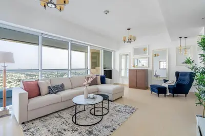 a living room with a couch and a table at GuestReady - Home away from home in JLT in Dubai