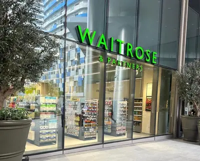 a walrus store with a green sign in the window at Dunya tower 2 downtown burj khalifa street Kings in Dubai