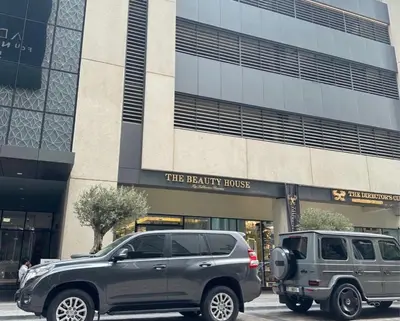 a gray suv parked in front of a building at Dunya tower 2 downtown burj khalifa street Kings in Dubai