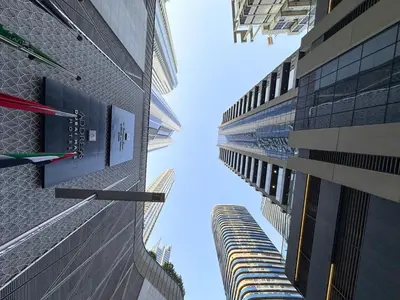 a view from between two tall buildings at AWS Holiday Homes - In the Heart of Downtown in Dubai