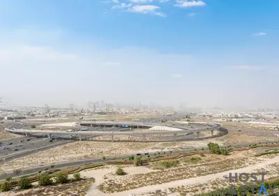an overhead view of a highway in a city at Lux 1BR Near Dubai Hills Mall in Dubai
