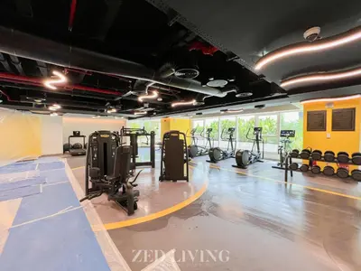a gym with treadmills and elliptical machines at Me Do Re - Luxury Living 1 BR with Panoramic View - Zed Living in Dubai