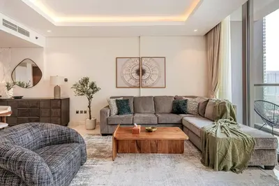a living room with a couch and a table at #140 Elegant 1BR with Burj Khalifa View in Business Bay in Dubai